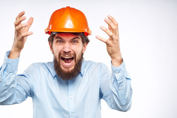 Man in an orange helmet shirt Engineering work construction cropped view