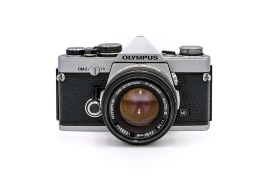 PARIS, FRANCE - AUGUST 21, 2019: vintage camera Olympus OM2 with a 50mm Zuiko lens isolated on a white background.
