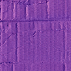 A violet vintage rough sheet of carton. Recycled environmentally friendly cardboard paper texture. Simple minimalist papercraft background.