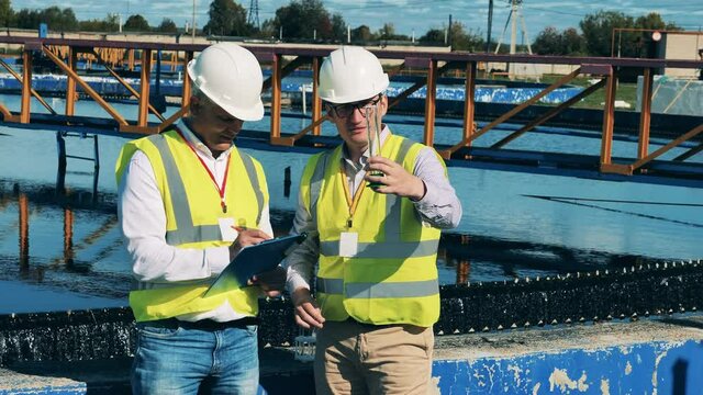 Workers of the wastewater facilities are inspecting a probe