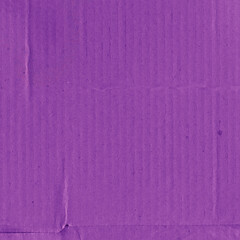 A violet vintage rough sheet of carton. Recycled environmentally friendly cardboard paper texture. Simple minimalist papercraft background.