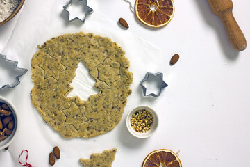 Gluten Free Christmas Cookies. Making homemade Christmas tree gluten-free cookies. Rolled dough and cutting molds, top view, flat lay, copy space