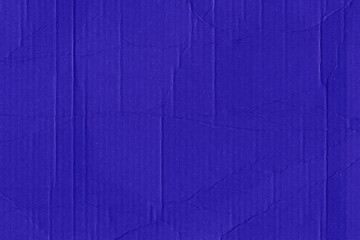 A violet vintage rough sheet of carton. Recycled environmentally friendly cardboard paper texture. Simple minimalist papercraft background.