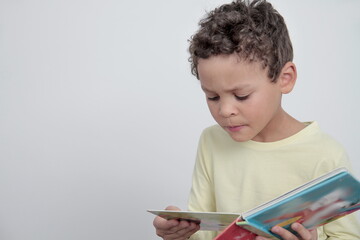 boy with school book going back to school on white background stock photo