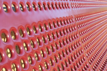 Fototapeta premium Perforated red surface