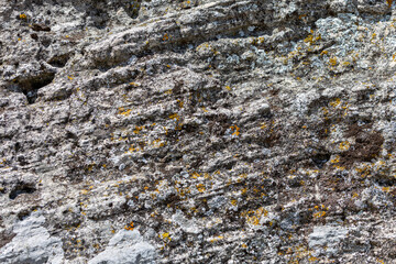 Old aged grunge deserted cobble boulder dry wall of the castle town. Crushed rugged relief grungy block, scary ruined quarry stone, built older decrepit cement waste facade, dirty crumbling fort side