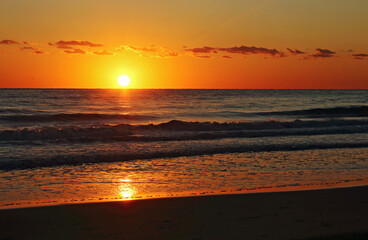A golden sunrise on the beach, Mediterranean sea