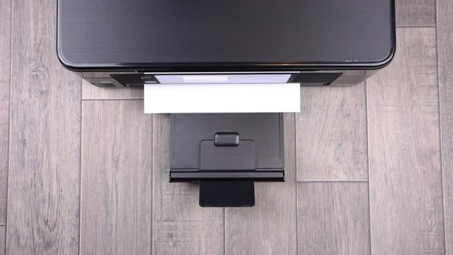 Printer printing blank a4 document from the top view