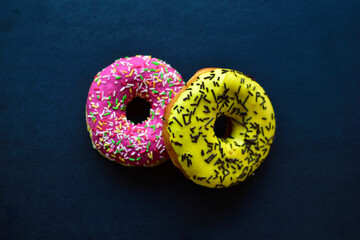 American delicious donuts on a black background