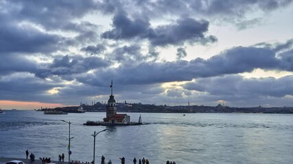 Beautiful cloudy sunset / evening at Bosphorus, Istanbul, Turkey. Timelapse clip with Maiden Tower, boats and landmarks of Istanbul 