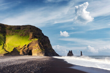 Incredible view on Black beach and Troll toes cliffs in cloudy weather. Reynisdrangar, Vik, Iceland. Landswcape photographyt