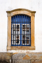 Fototapeta na wymiar Ancient colonial window in historical city of Ouro Preto, Brazil
