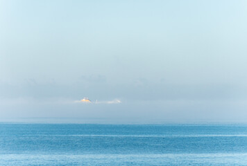 Ship disappearing in the sea fog
