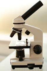 Medical microscope on glass table