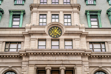 Fototapeta premium The clock above the entrance of a courthouse in Boston