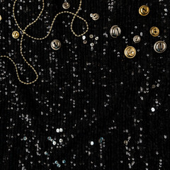 Black sparkling glitter background with tinsel confetti. Christmas. New Year holidays celebration minimalistic concept.
