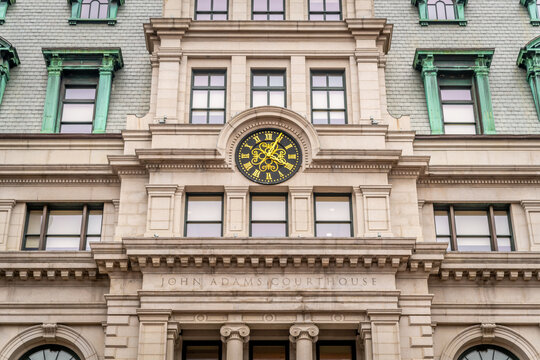 The clock above the entrance of a courthouse in Boston