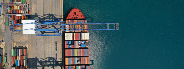 Aerial top down ultra wide photo of industrial cargo container ship loading in logistics terminal port - obrazy, fototapety, plakaty