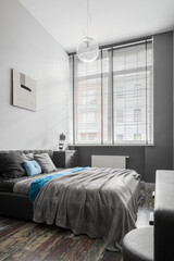 Stylish gray bedroom with double bed