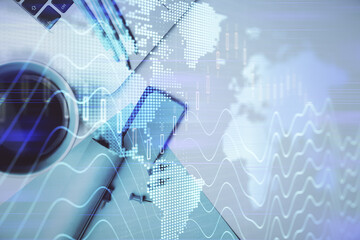 Double exposure of forex graph drawing over desktop background with computer. Concept of financial analysis. Top view.