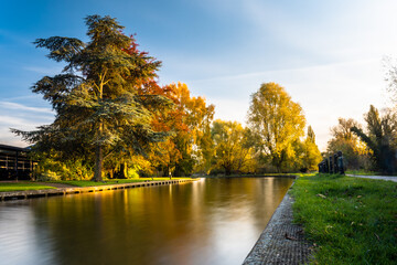 Lon exposure image of the river Cam in autumn, Cambridge, UK