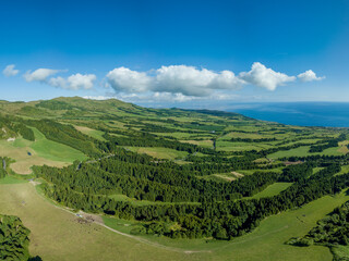 Fototapeta na wymiar Panoramic view over the majestic green landscape and the Atlantic ocean, in the North Coast of the island of São Miguel in the Azores.