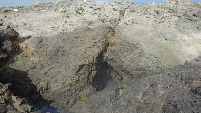 spray from a small wave at kiama blowhole on the nsw south coast of australia
