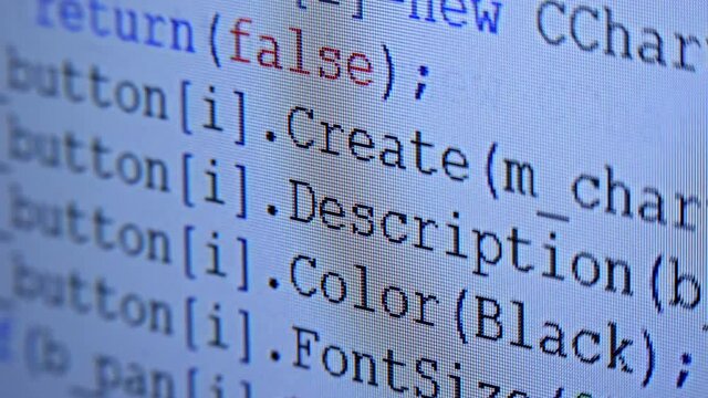 Lines of programmes code run across the white screen. Hacker tries to break security and commit data theft. Closeup