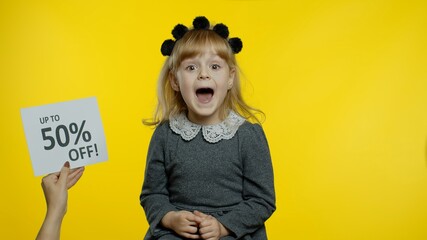 Inscription advertising Up To 50 Percent Off appears next to smiling kid girl. Teen pupil celebrating, dancing, looking satisfied with low prices, discounts, shopping on Black Friday