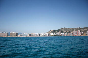 Fototapeta premium Panoramic view from the sea, of the holiday town of Cullera in Valencia, southern Spain.