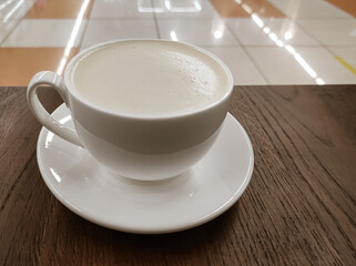 White cup of coffee with milk