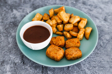 plant-based food, vegan curried jackfruit nuggets with rosemary potatoes and mushroom gravy