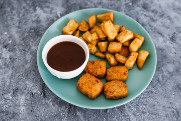 plant-based food, vegan curried jackfruit nuggets with rosemary potatoes and mushroom gravy