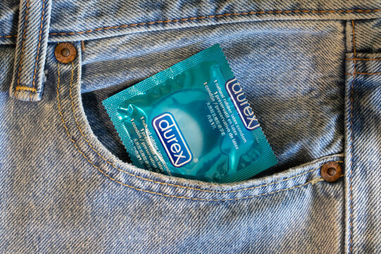 Saint Petersburg, Russia - 17 March 2020: Durex contraceptive condom for safe sex in jeans pocket close-up, Illustrative Editorial