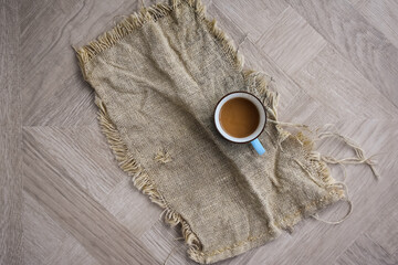 Coffee Cup on Linen Material Beautiful Design Wooden Table Top View