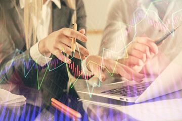 Double exposure of man and woman working together and forex chart hologram. Business concept. Computer background.
