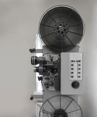 old 8mm Film Projector isolated on gray wall background.vintage classic film projector with vintage...
