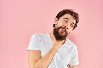 Bearded man white t-shirt cropped view lifestyle studio pink background