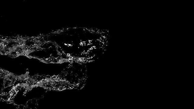 Water splashing on black background, super slow motion. Filmed on high speed cinema camera, 1000 fps.
