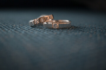 ring with diamonds on blue background macro photography
