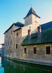 Old stone chateau on river near Annecy, France.
