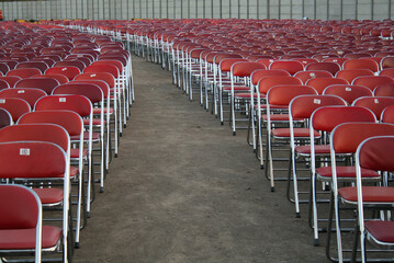 Lots of empty red chairs