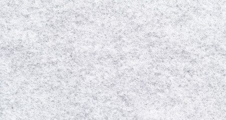 Snow white felt background. Surface of fabric texture in white winter color.