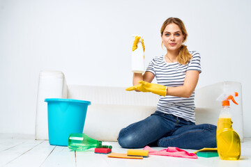 Woman at home washes the floors providing services interior homework