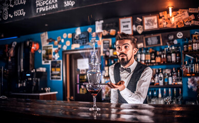 Barman makes a cocktail in the brasserie