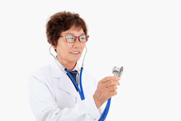 Experienced old doctor holding stethoscope in hand in front of white background