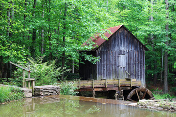 An historic mill near Marietta with green leafs in late spring.