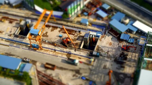Miniature 4K Time lapse video of clamshell excavator working at Construction site. 