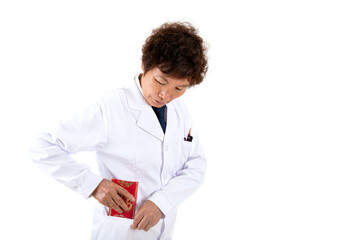 The Chinese female doctor in front of a white background puts the received red envelope into her pocket