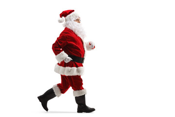 Full length profile shot of santa claus running